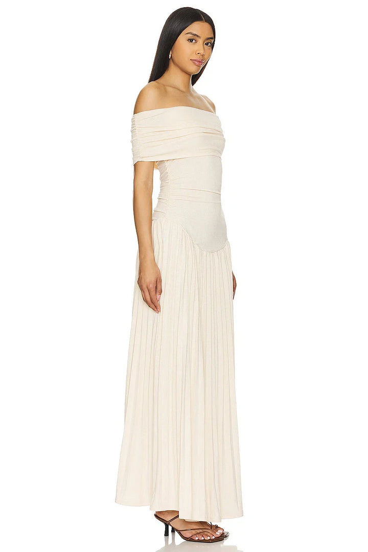 Navy pleated off-shoulder maxi dress, elegant and flowy summer style.