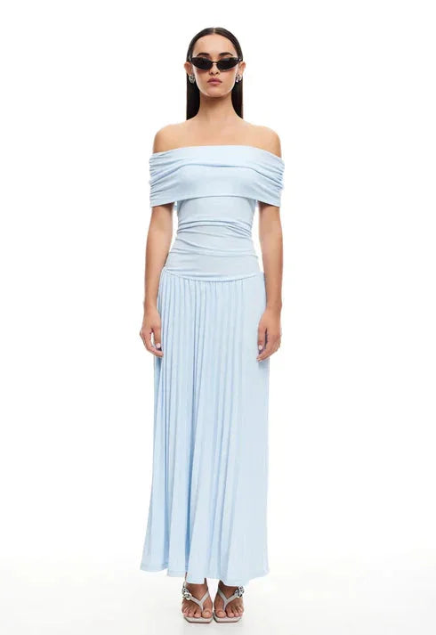 Cream off-shoulder pleated maxi dress, flowy for summer vacation wear.