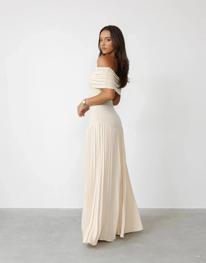Elegant cream off-shoulder maxi dress, pleated for summer style.