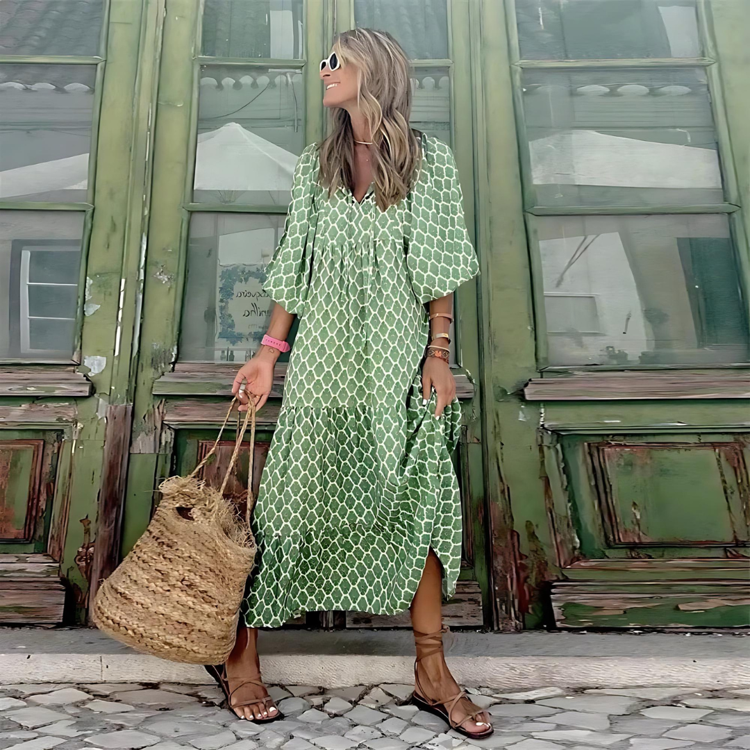 Chic green patterned flowy maxi dress for women, featuring long sleeves and a flattering V-neck, ideal for spring fashion.