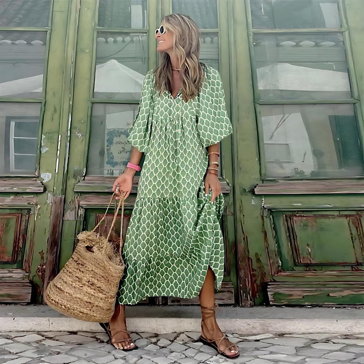 Chic green patterned flowy maxi dress for women, featuring long sleeves and a flattering V-neck, ideal for spring fashion.