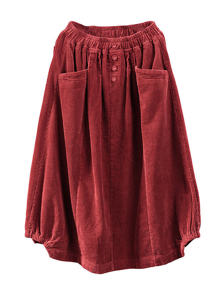 Flowy pleated maxi skirt for women, detailed with functional buttons and deep pockets, perfect for fashion.