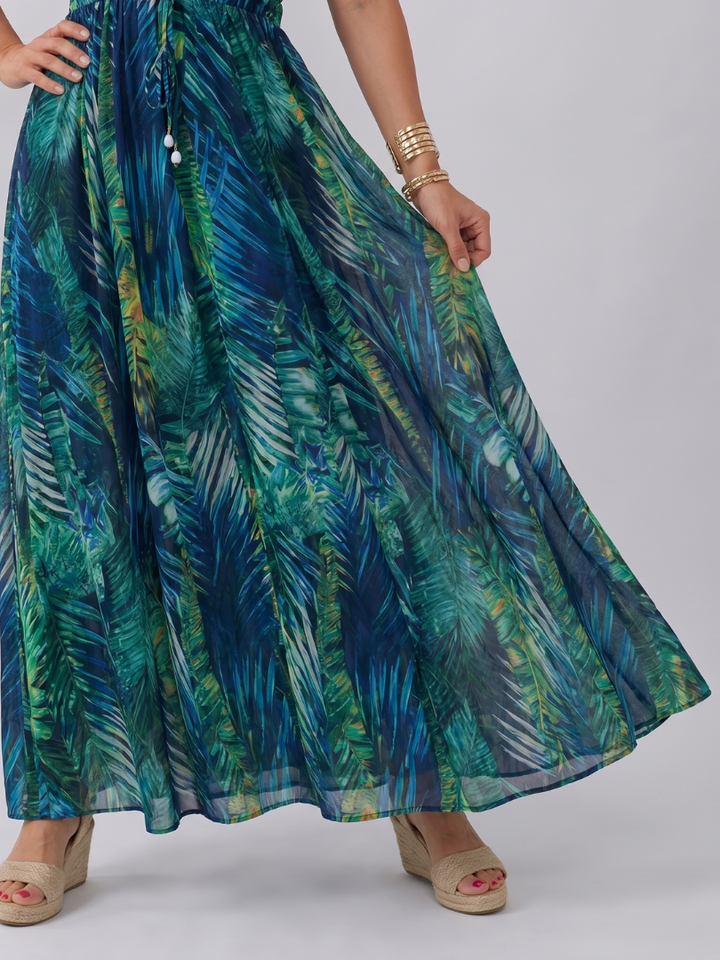 Elegant women's flowy empire waist midi dress, ideal for warm weather and vacation wear.