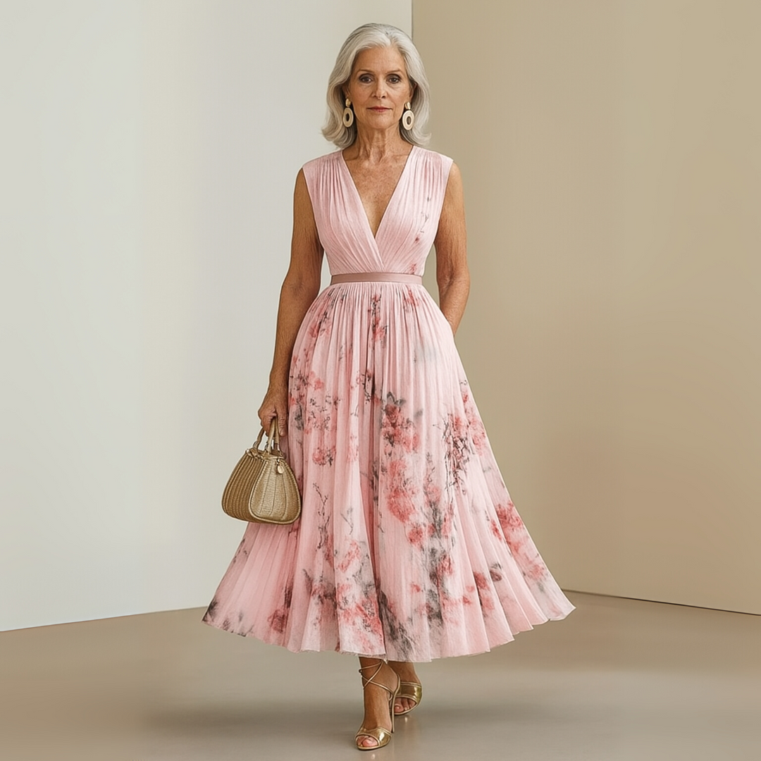 Women's long flowy sleeveless summer maxi dress in a beautiful print, beach-ready.