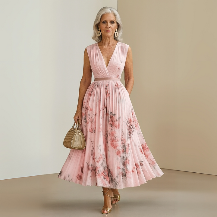 Women's long flowy sleeveless summer maxi dress in a beautiful print, beach-ready.