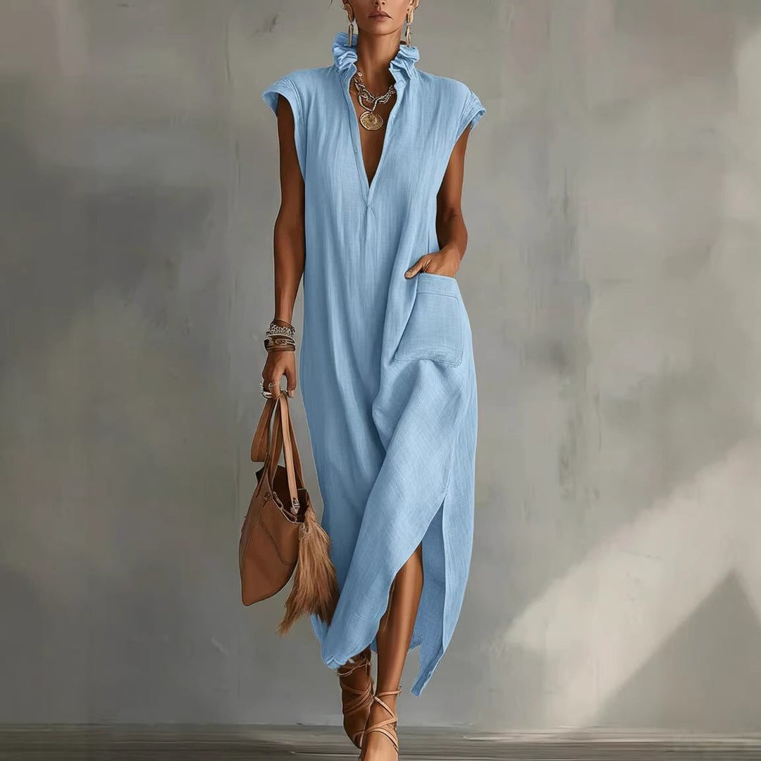 Women's sleeveless flowy midi dress, featuring a stylish V-neck, ruffled collar, and asymmetrical hem.