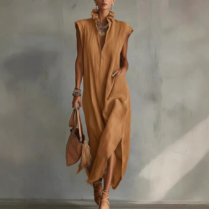 Versatile women's sleeveless midi dress: flowy fabric, asymmetrical hem. Perfect for casual summer or elegant events.
