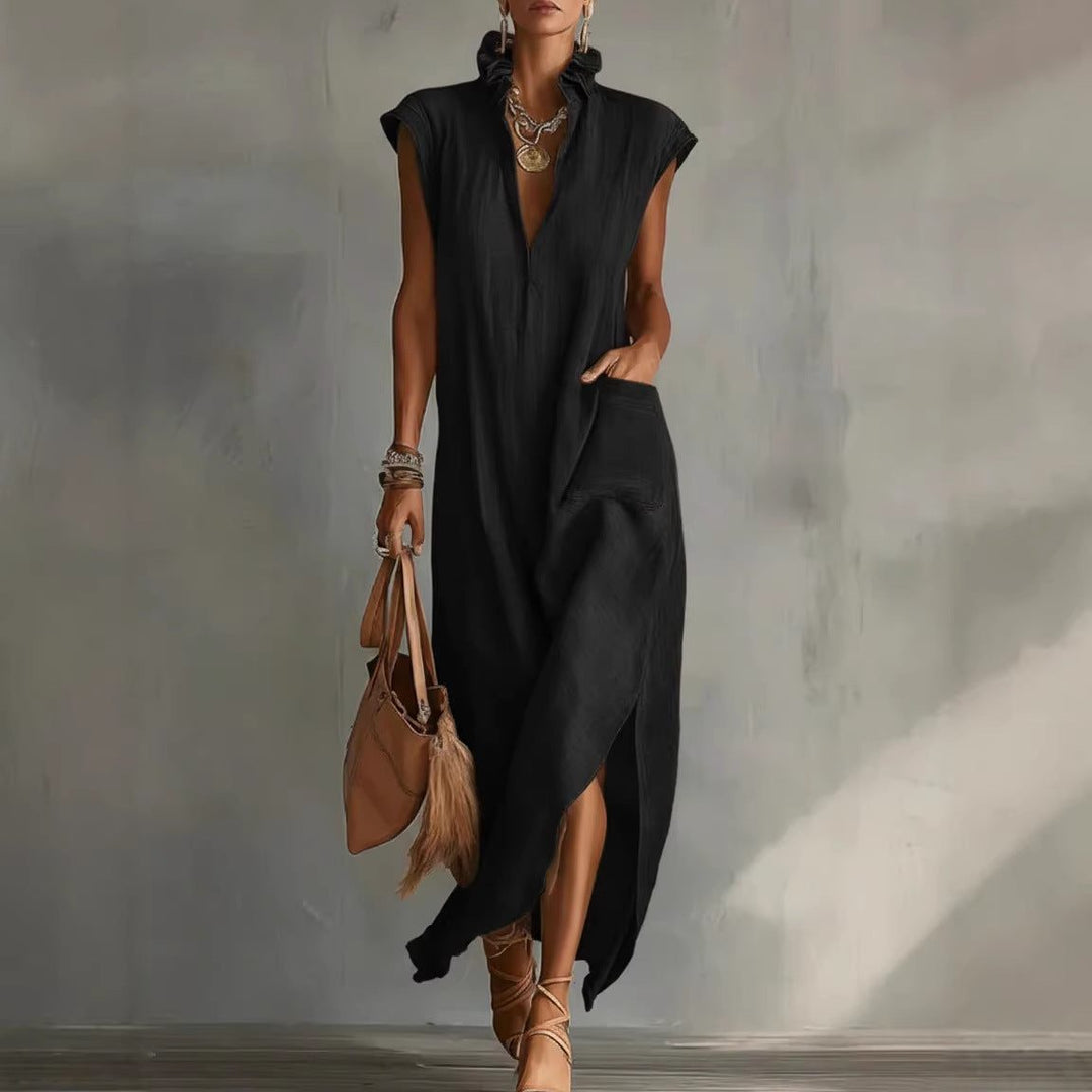 Chic women's flowy sleeveless midi dress. Features an asymmetrical hem, V-neck, and subtle ruffled collar detail.