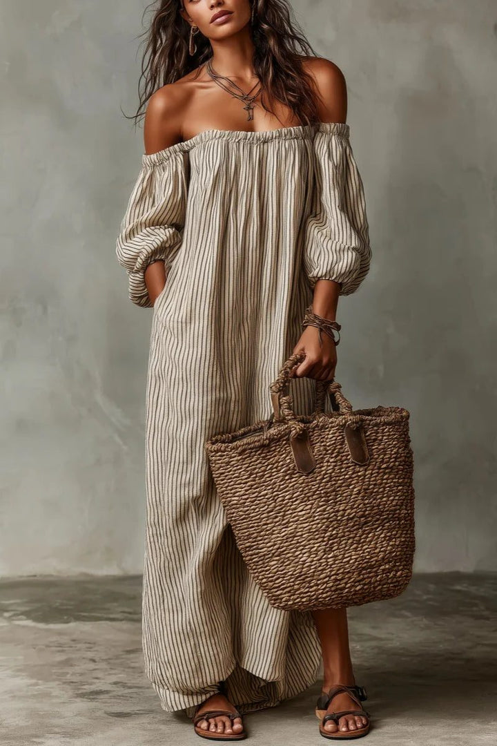 Elegant women's off-shoulder striped maxi dress; flowy, comfortable fabric perfect for vacation wear.