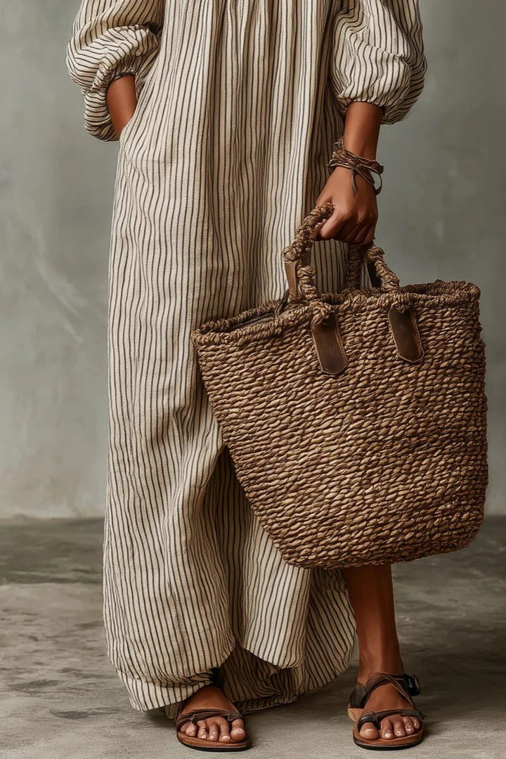 Women's elegant flowy maxi dress featuring off-shoulder neckline and stylish stripes, great for summer.