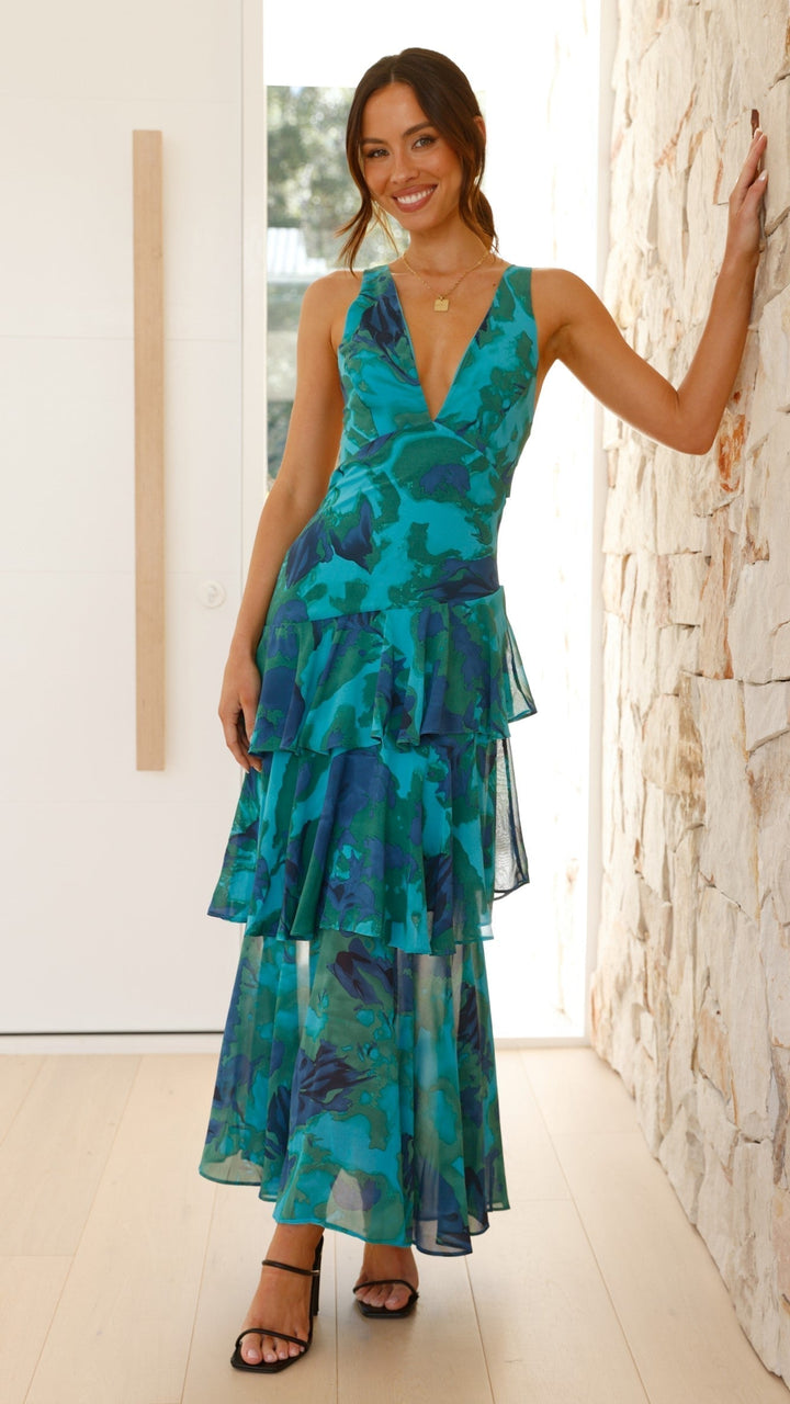 Stylish women's patterned maxi dress, layered and flowy. Sleeveless V-neck design for a chic summer look.