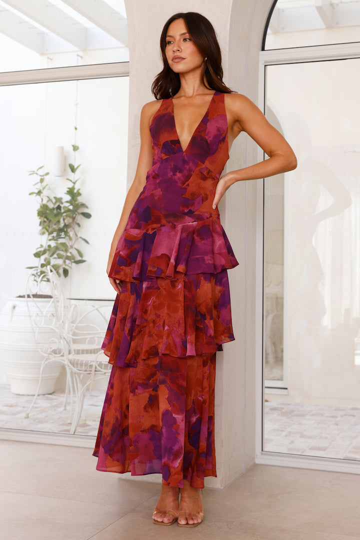 Chic women's flowy maxi dress with a unique pattern, layered tiers, and a flattering V-neck cut.