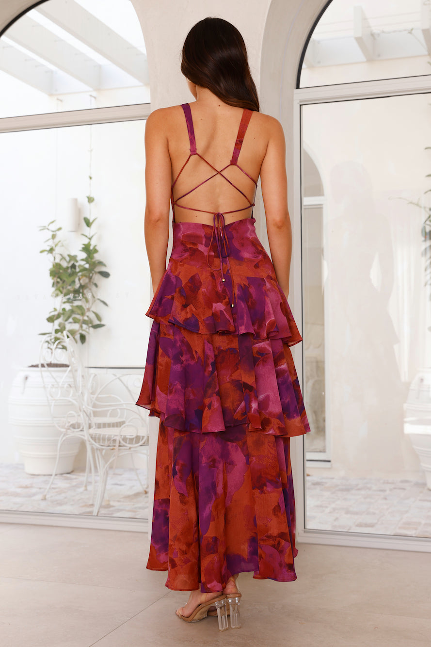 Fashionable women's patterned maxi dress, featuring flowy layers, a tiered design, and a sleeveless V-neck.