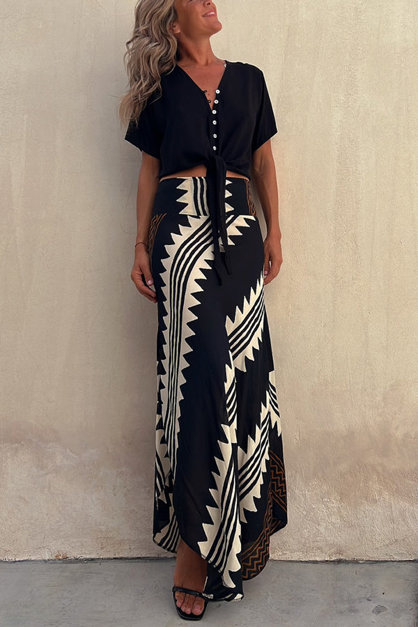 Women's flowy tiered pleated maxi skirt with elastic waist. Comfortable and elegant for everyday wear.