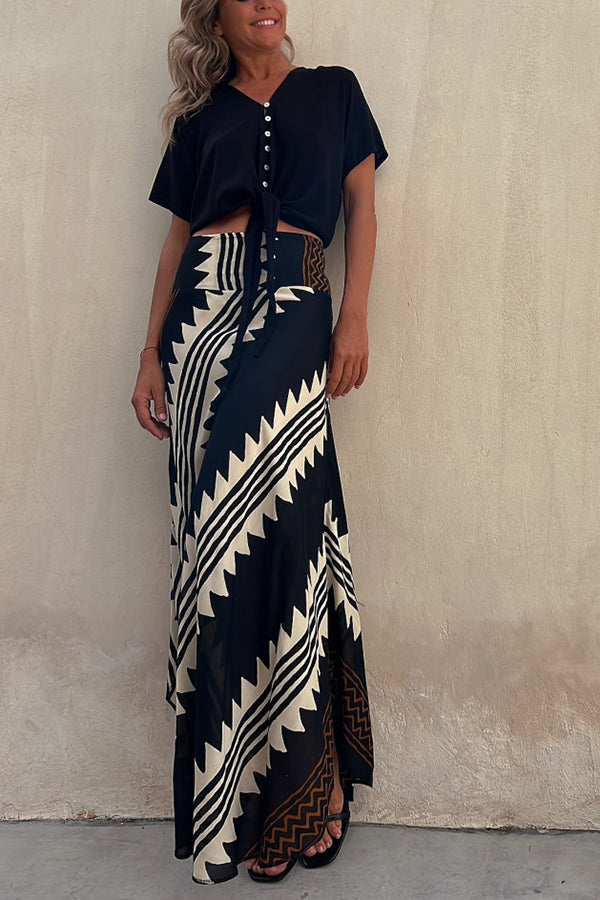 Stylish women's flared maxi skirt with delicate pleats and flowy tiers, perfect for summer fashion.