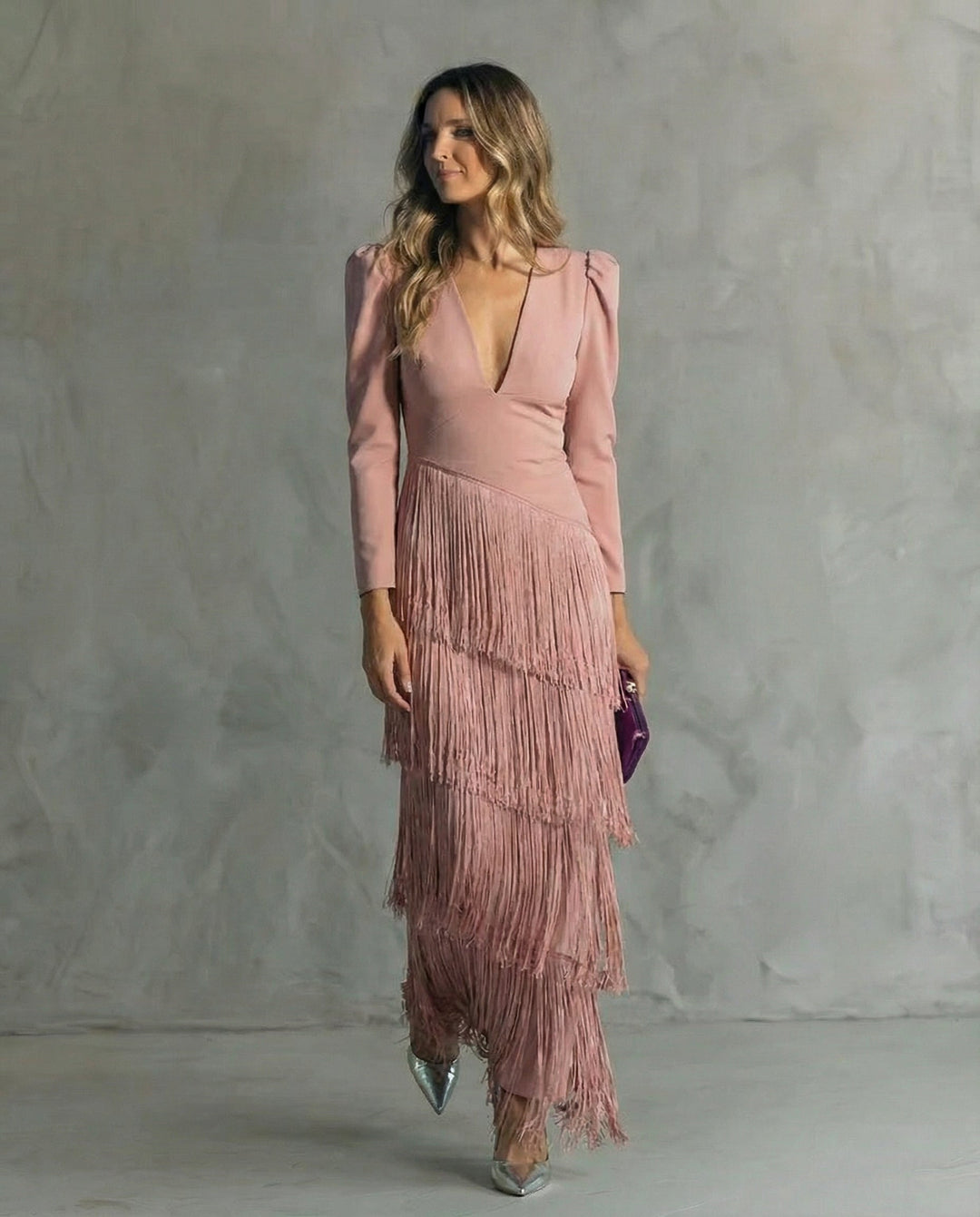 Flowy long sleeve v-neck women's midi dress featuring elegant fringe details, perfect for a sophisticated party look.