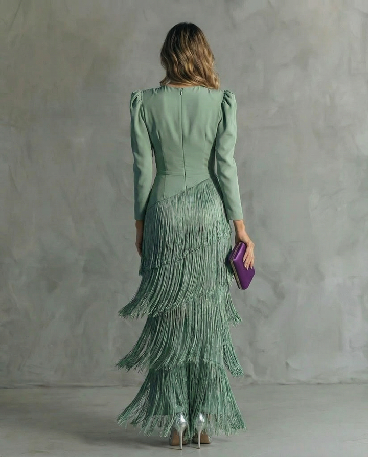 Stylish women's long sleeve v-neck flowy dress with elegant fringe, a perfect midi length for evening occasions.