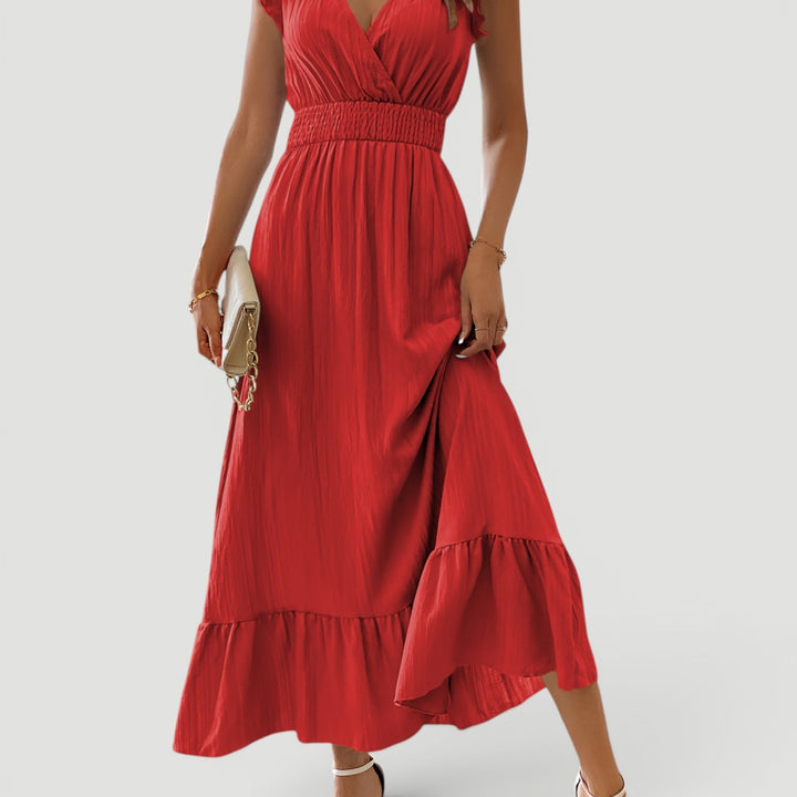 Elegant long women's dress, V-neck flowy maxi style, ideal for summer evenings.