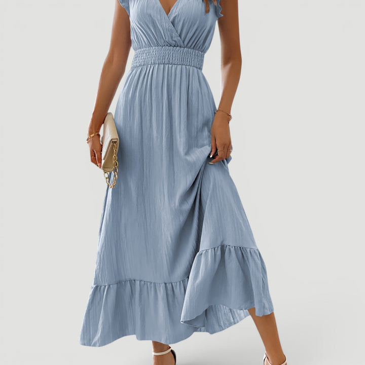 Long women's flowy maxi dress, V-neck, perfect for elegant evening wear or summer parties.
