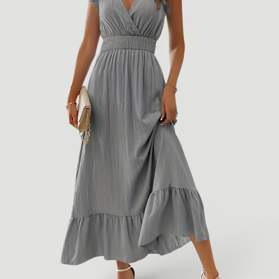 Women's elegant flowy maxi dress, V-neck, suitable for evening events & summer parties.