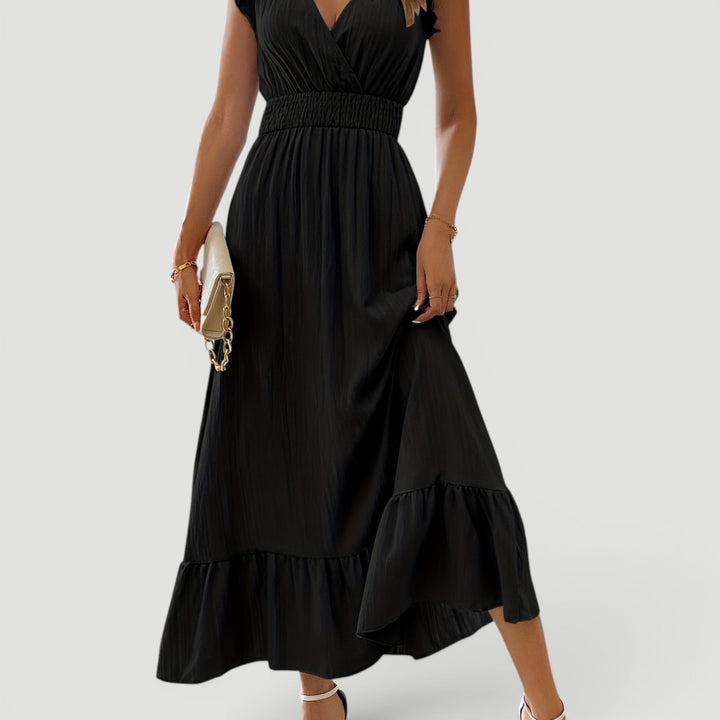 Women's evening maxi dress, elegant V-neck, flowy fabric, perfect for special occasions.