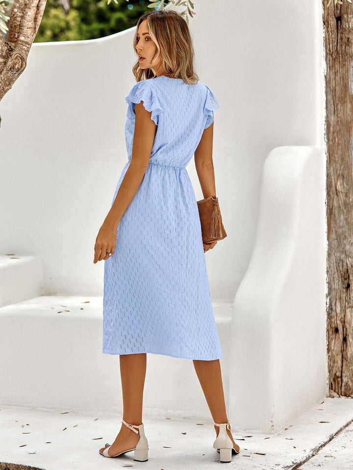 Elegant women's summer dress: a chic V-neck flowy midi with playful ruffled sleeves, ideal for events.