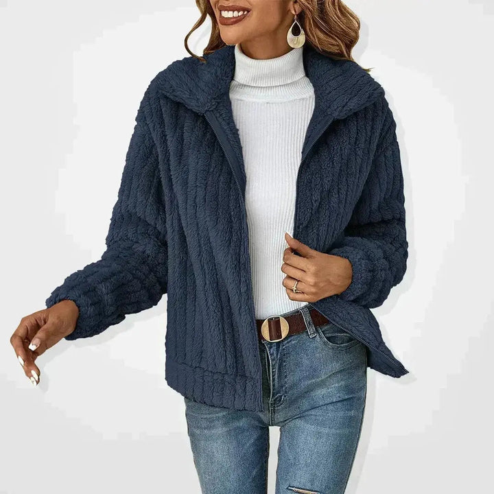 Cozy women's fluffy quilted winter jacket with a convenient zip-up front. Ideal casual outerwear for warmth.