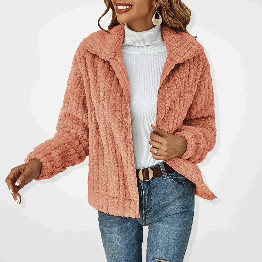 Warm women's fluffy zip-up coat, a stylish quilted jacket perfect for winter. Casual and comfortable.