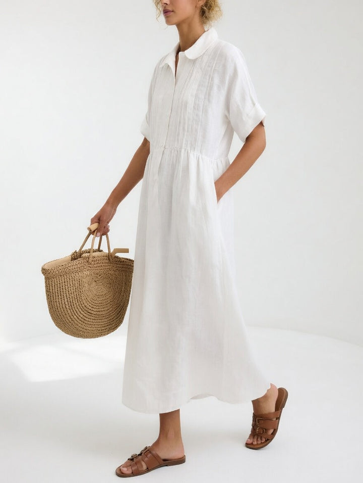 Women's fluid summer shirt dress with button front, perfect for casual elegance & comfort.