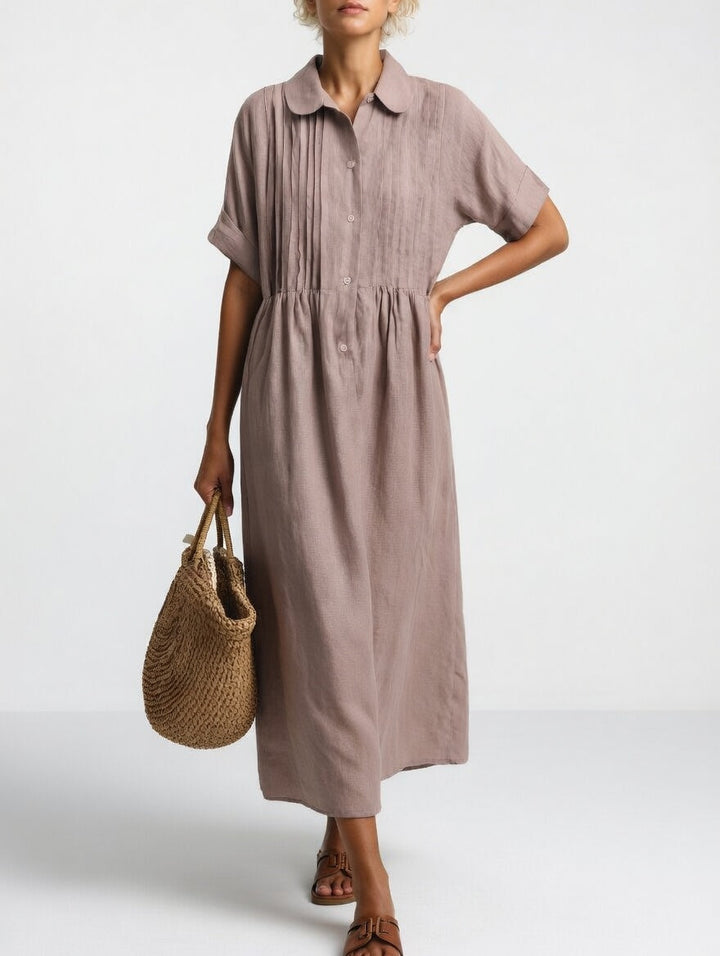 Stylish women's summer shirt dress, providing fluid comfort & easy elegance for any occasion.