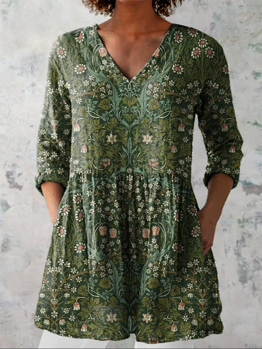 Women's fluid V-neck long blouse in green, featuring a relaxed, elegant fit for versatile casual chic style and comfort.