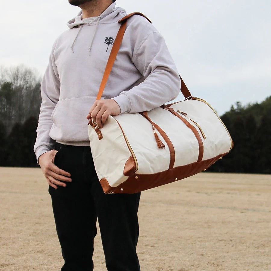 Detail of secure zippers on women's durable travel bag for safe, multi-compartment smart organization.