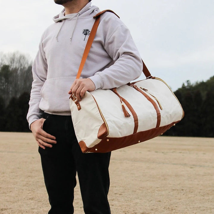 Detail of secure zippers on women's durable travel bag for safe, multi-compartment smart organization.