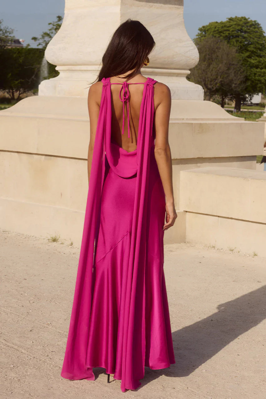 Flowy fuchsia maxi wedding guest dress with a sophisticated cowl neck, ideal for formal occasions.