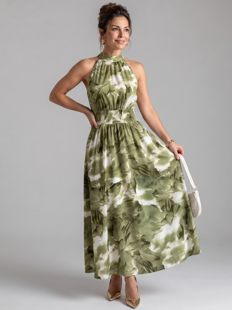 Women's gathered waist abstract print midi dress. Elegant sleeveless summer style.