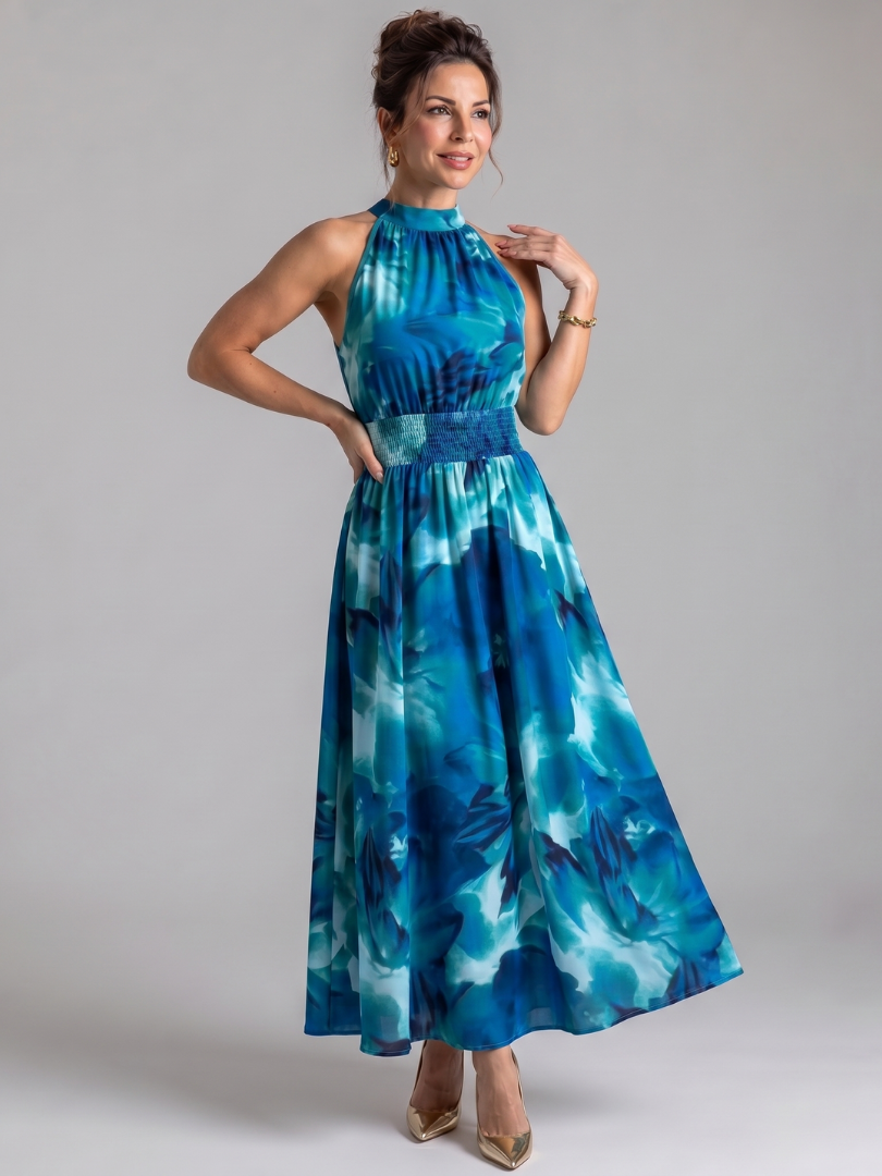 Full length view of a flowing sleeveless abstract print midi dress for women.