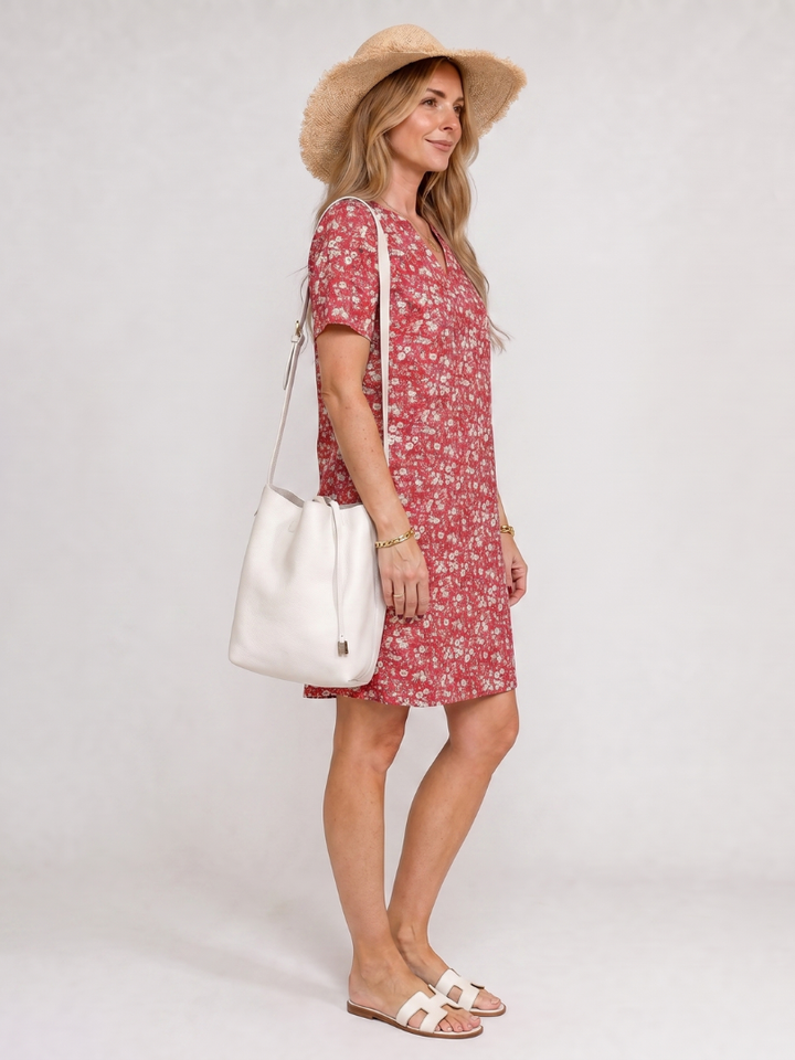 Stylish casual women's summer dress with vibrant geometric print, knee-length, short sleeves.