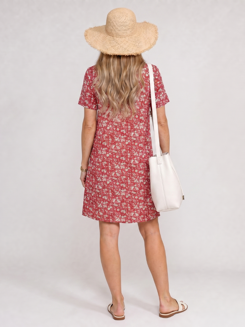 Printed short sleeve knee-length dress for women, bold geometric pattern, comfortable fit.
