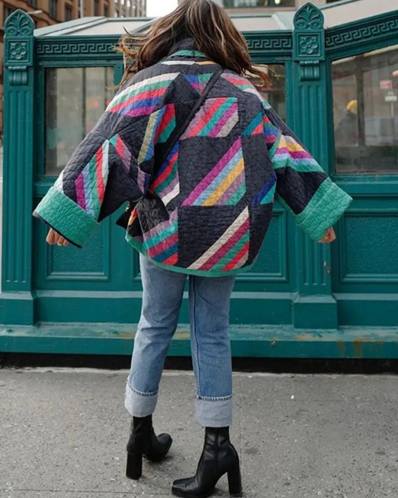 Stylish women's geometric print quilted jacket, open front, multi-color. Relaxed fit fashion statement outerwear.