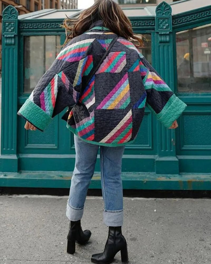 Stylish women's geometric print quilted jacket, open front, multi-color. Relaxed fit fashion statement outerwear.