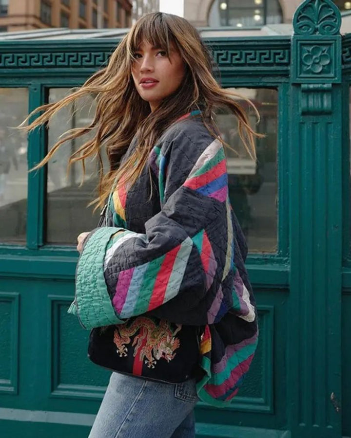 Multi-color geometric print quilted jacket for women. Features an open front, long sleeves, and relaxed fashion fit.
