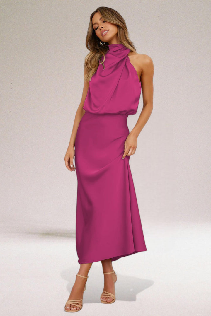 Luxurious women's halter neck maxi dress. A glamorous evening gown perfect for formal events and parties.