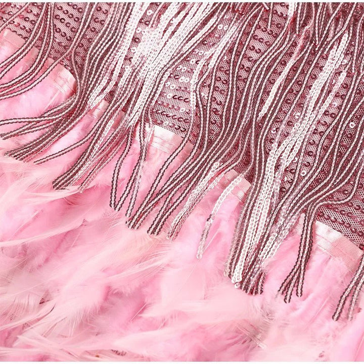 Dazzling women's mini party dress with sequins and fringe, perfect for glamorous nights.