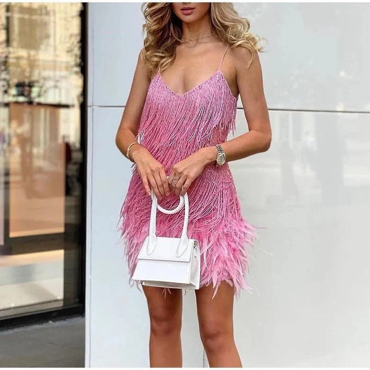 Chic women's evening dress featuring sparkling sequins and stylish fringe.