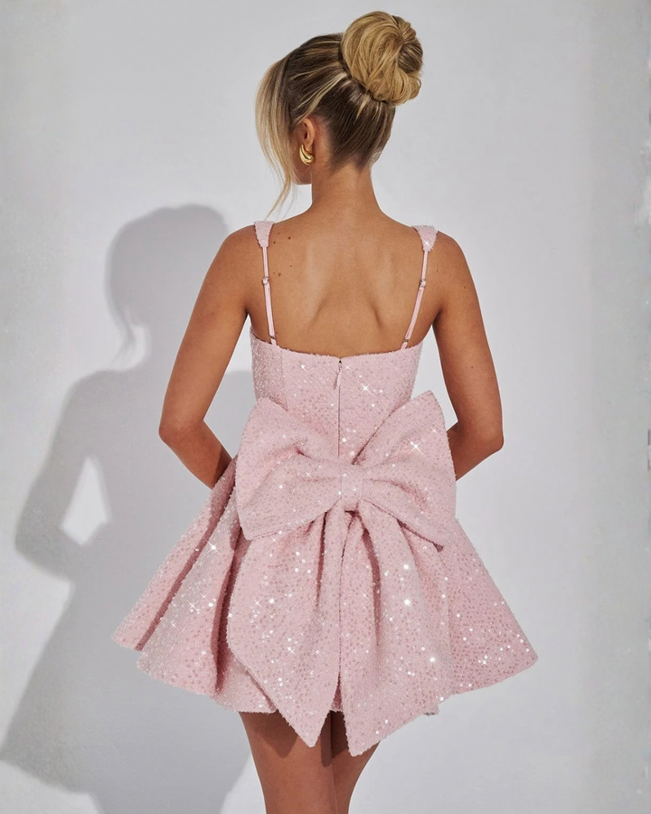 Elegant women's sequin square neck mini dress featuring a charming bow. Ideal for evening wear, cocktail parties.