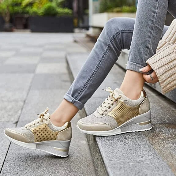 Women's glitter hidden-wedge platform sneakers with lace-up detail. Perfect for elevated casual style.