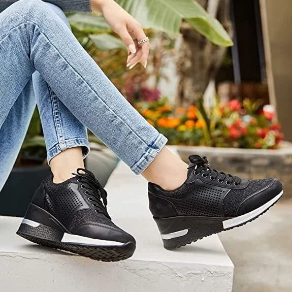 Comfortable women's hidden-wedge platform sneakers, featuring a sparkling glitter finish and lace-up.