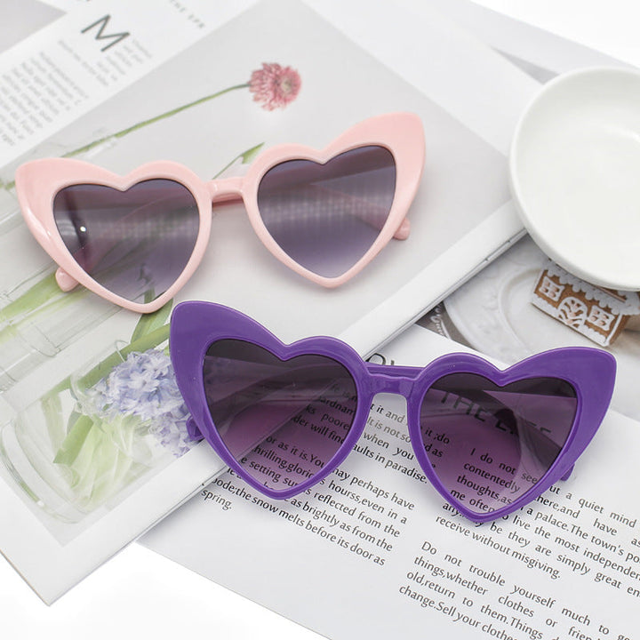 Women's glittering heart sunglasses, trendy fashion accessory with UV protection, perfect for summer.