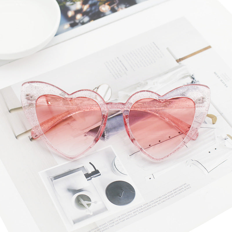 Glittering heart sunglasses for women, a sparkling fashion accessory. Provides trendy style & vital UV protection.