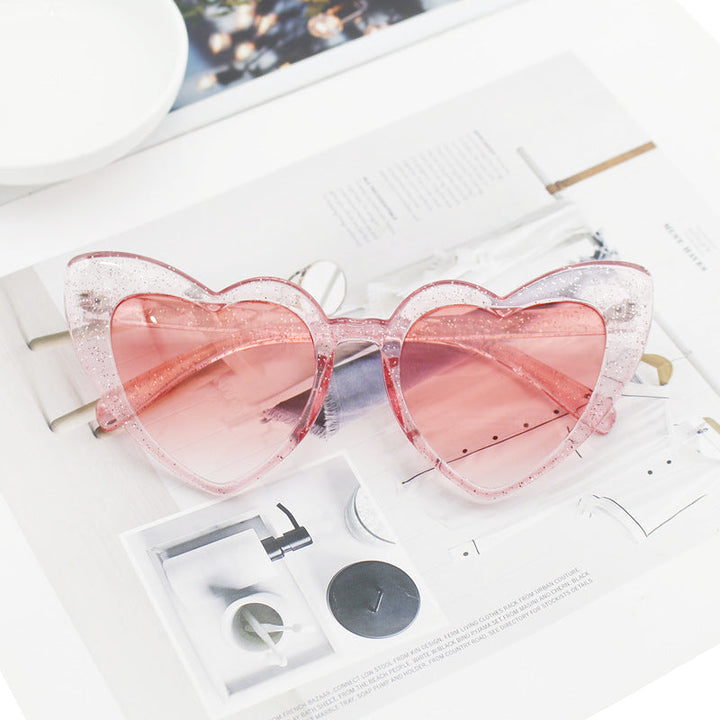 Glittering heart sunglasses for women, a sparkling fashion accessory. Provides trendy style & vital UV protection.